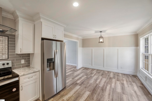 kitchen with appliances with stainless steel finishes, backsplash, crown molding, light hardwood / wood-style floors, and white cabinetry