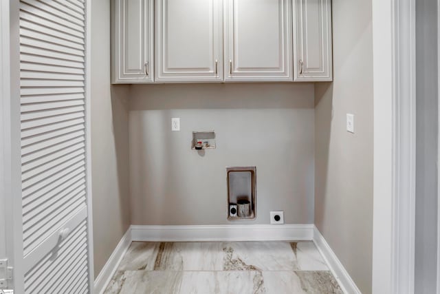 laundry room with electric dryer hookup, cabinets, and hookup for a washing machine