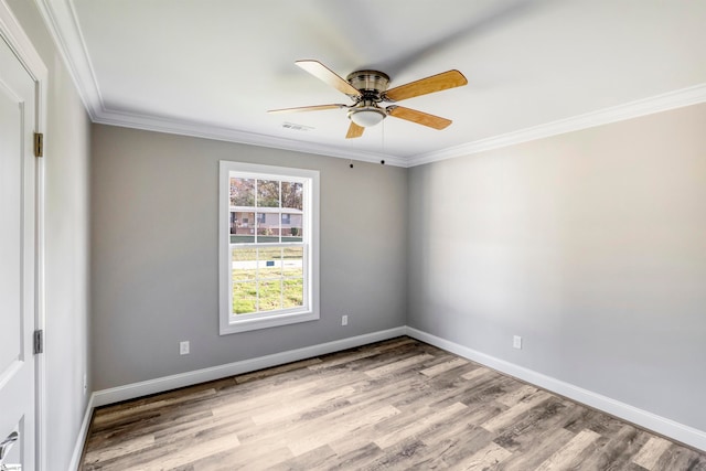 empty room featuring crown molding, ceiling fan, and light hardwood / wood-style floors