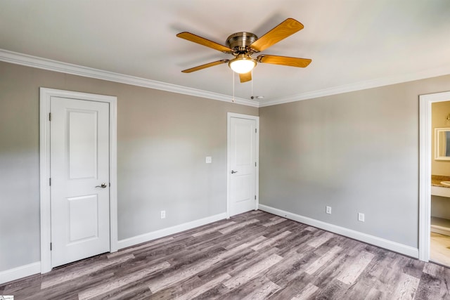 unfurnished room featuring ceiling fan, hardwood / wood-style floors, and ornamental molding