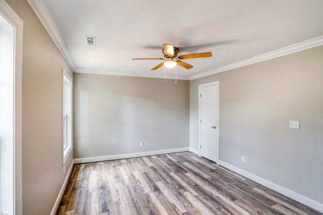 unfurnished room featuring crown molding, hardwood / wood-style floors, and ceiling fan