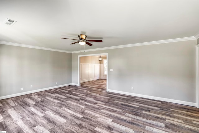 spare room with hardwood / wood-style flooring, ceiling fan, and ornamental molding