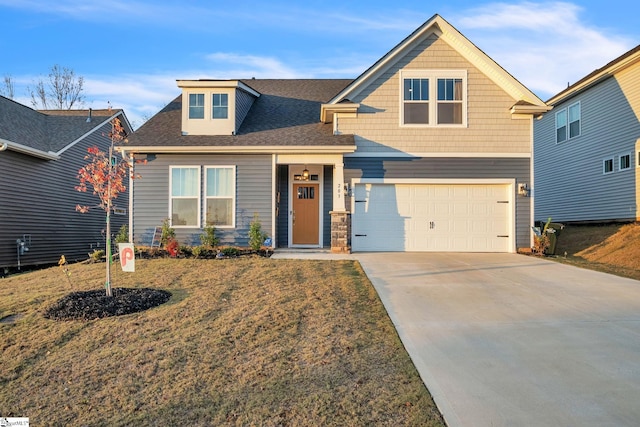 craftsman-style home with a garage and a front lawn