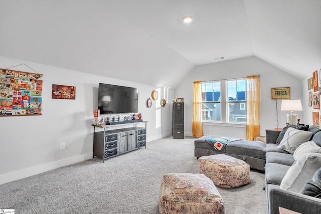 living room featuring carpet flooring and vaulted ceiling