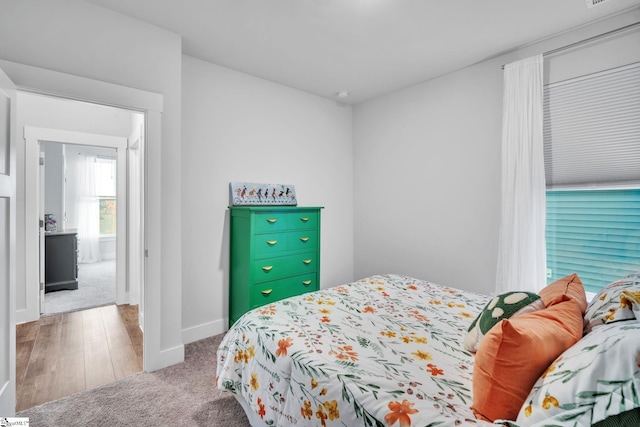 bedroom with hardwood / wood-style floors