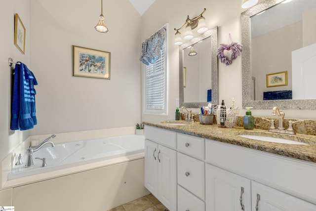 bathroom featuring tile patterned flooring, vanity, lofted ceiling, and a tub to relax in