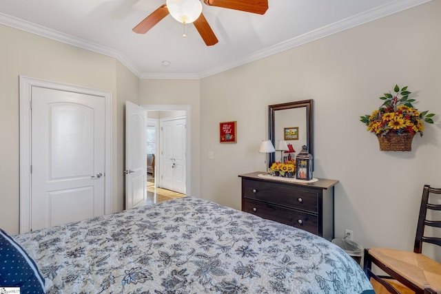 bedroom with ceiling fan, light hardwood / wood-style floors, and crown molding