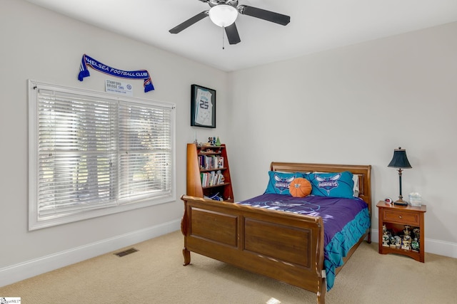 carpeted bedroom featuring ceiling fan