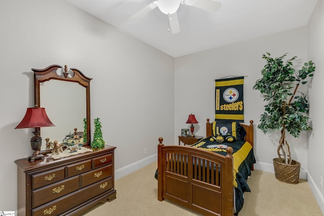 bedroom with light colored carpet and ceiling fan