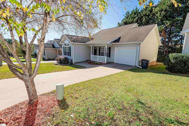 view of front of property featuring a front yard and a garage