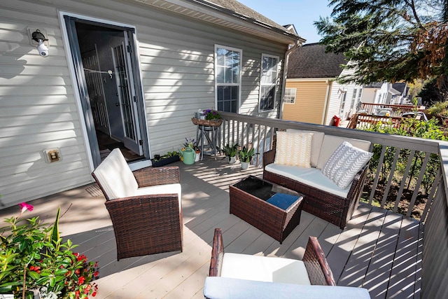 wooden deck featuring an outdoor living space