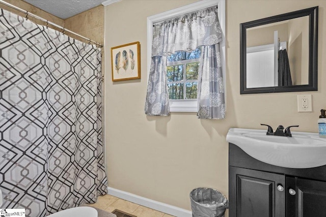 bathroom featuring a shower with curtain, tile patterned flooring, a textured ceiling, toilet, and vanity