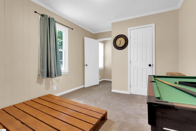 unfurnished bedroom featuring carpet flooring, ornamental molding, and billiards