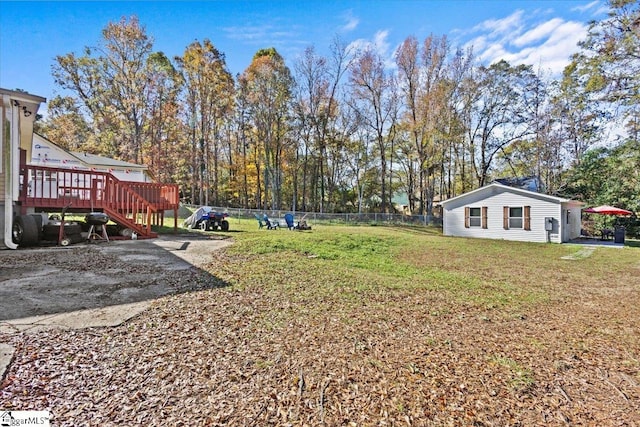 view of yard with a wooden deck