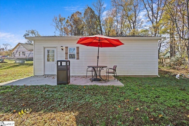 view of outbuilding featuring a yard