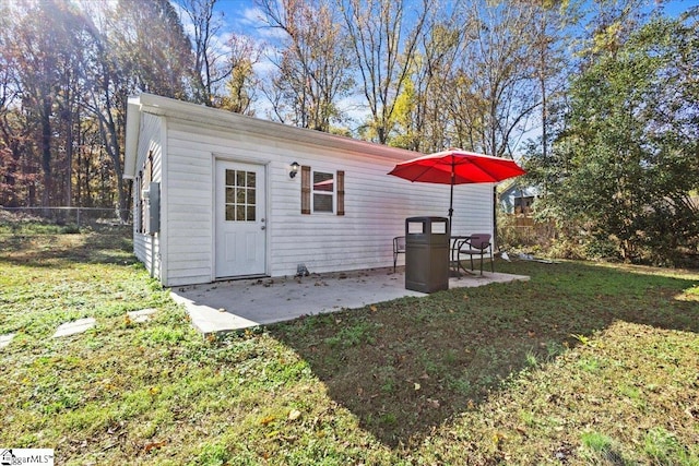 view of outbuilding featuring a yard