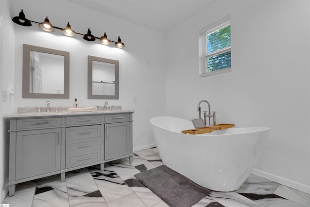 bathroom featuring vanity and a tub to relax in