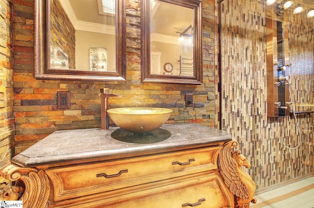 bathroom with vanity and ornamental molding