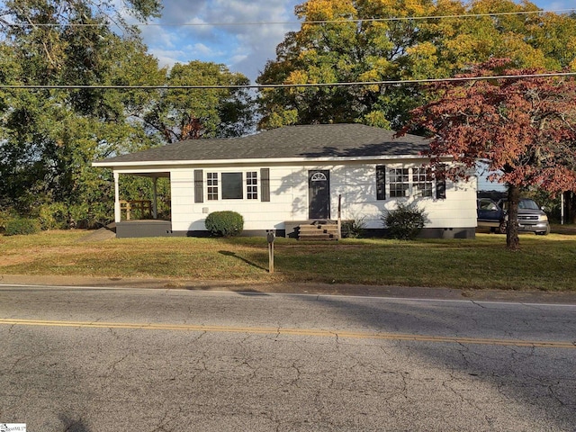 ranch-style home with a front yard