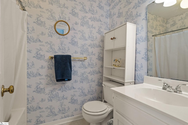 bathroom featuring vanity and toilet