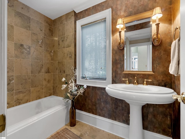 bathroom with sink, tile patterned flooring, and a washtub