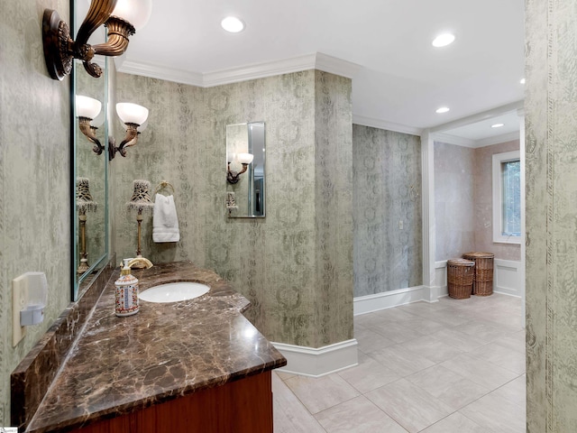 bathroom featuring crown molding, tile patterned flooring, and vanity