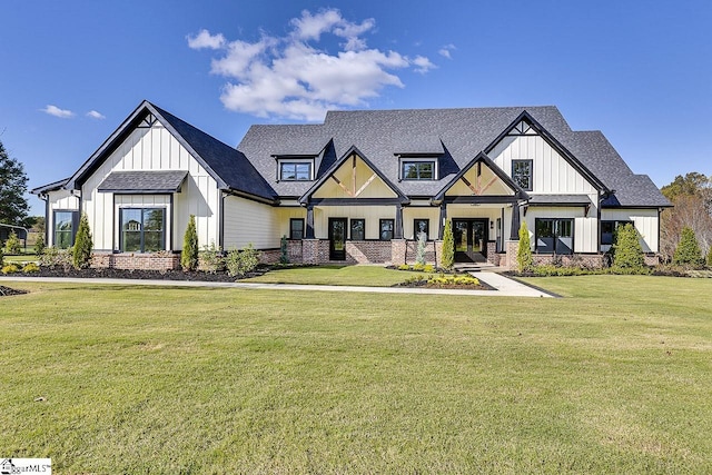 modern farmhouse style home featuring a front yard