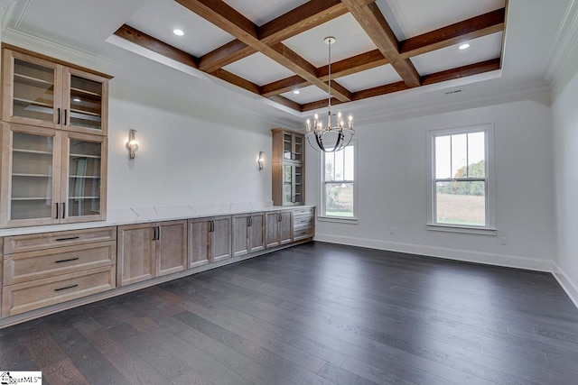 interior space featuring dark wood-type flooring, coffered ceiling, crown molding, beamed ceiling, and a notable chandelier