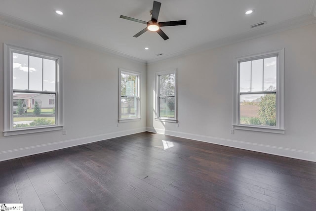 empty room featuring dark hardwood / wood-style floors, ceiling fan, and crown molding