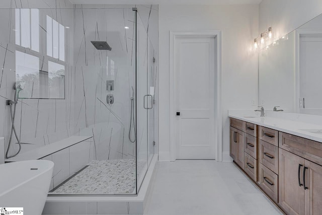 bathroom with vanity and independent shower and bath