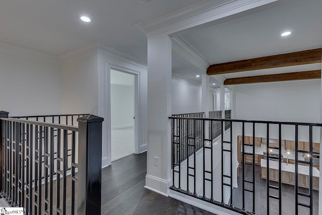 corridor with beamed ceiling, dark hardwood / wood-style flooring, and crown molding