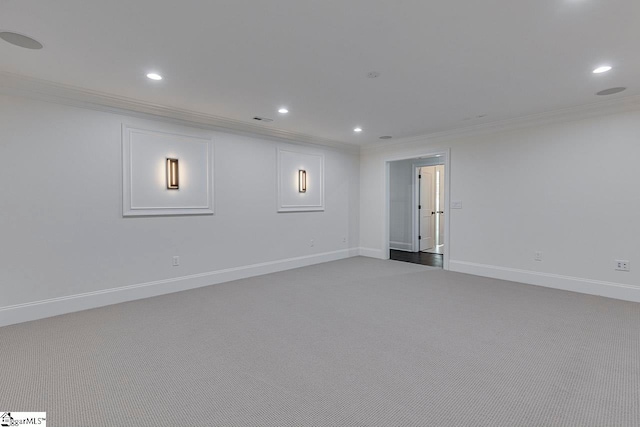 basement with carpet floors and ornamental molding