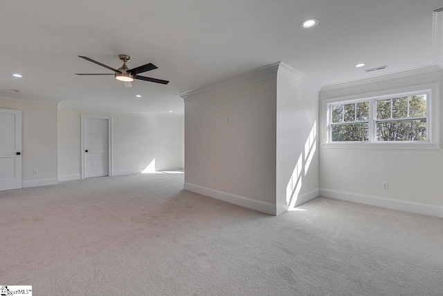 unfurnished room featuring light carpet, ceiling fan, and ornamental molding