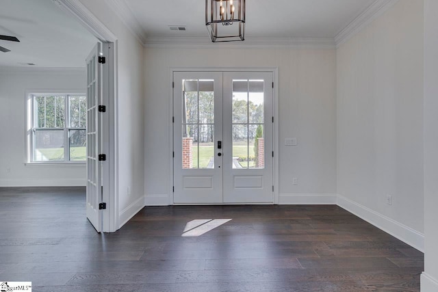 doorway to outside with french doors, dark hardwood / wood-style floors, and crown molding