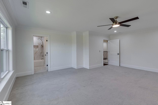 unfurnished bedroom featuring ceiling fan, ornamental molding, light carpet, and ensuite bath