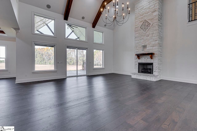 unfurnished living room with a fireplace, high vaulted ceiling, and dark wood-type flooring