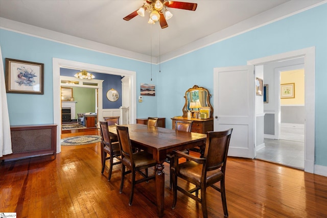 dining room with hardwood / wood-style floors and ceiling fan