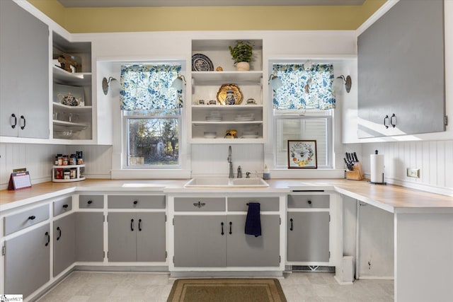 kitchen featuring gray cabinetry and sink