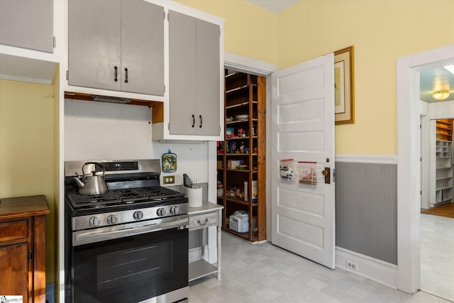 kitchen featuring gray cabinetry and stainless steel gas stove