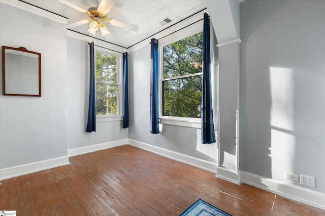 empty room featuring hardwood / wood-style flooring and ceiling fan