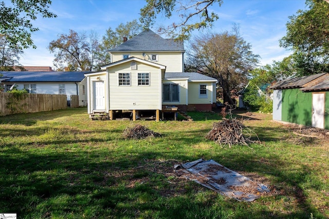 back of property with a yard