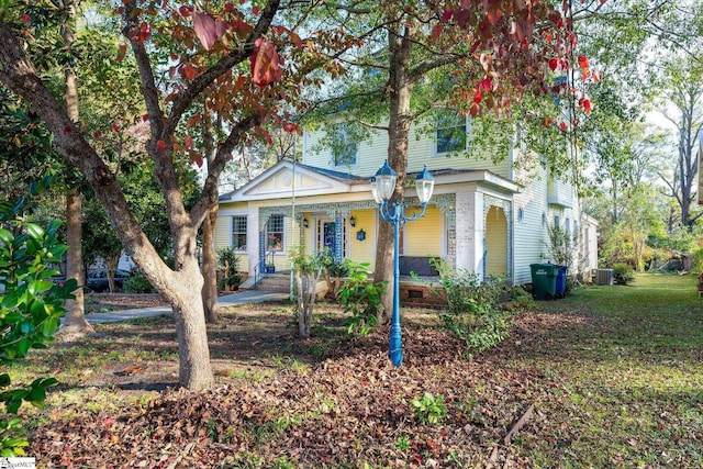 view of front facade featuring covered porch and central AC