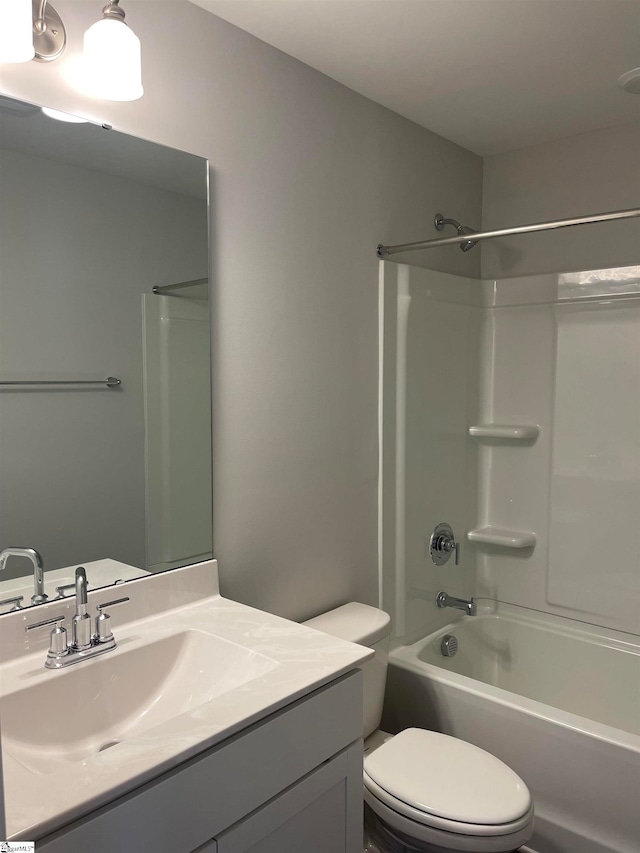 full bathroom with vanity, toilet, and shower / washtub combination