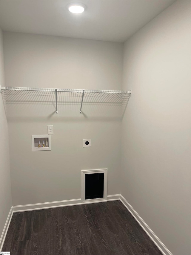 washroom featuring hookup for a washing machine, dark hardwood / wood-style floors, and electric dryer hookup