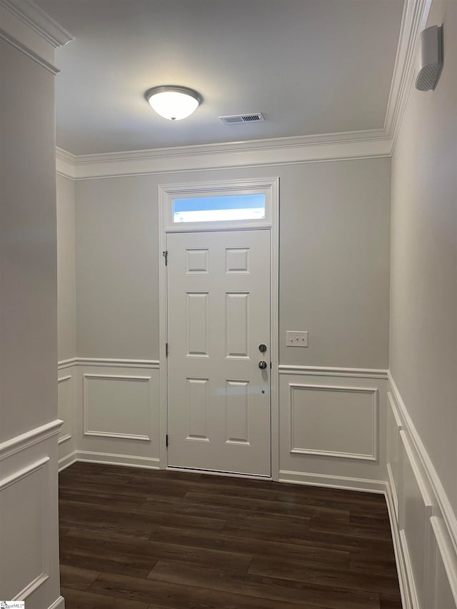 foyer entrance featuring dark hardwood / wood-style flooring and ornamental molding