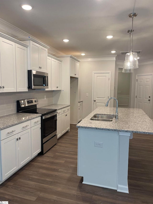 kitchen with white cabinets, sink, an island with sink, and appliances with stainless steel finishes