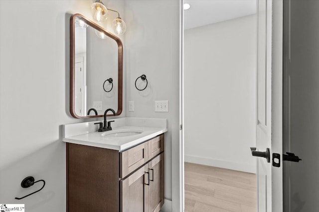 bathroom featuring vanity and hardwood / wood-style flooring