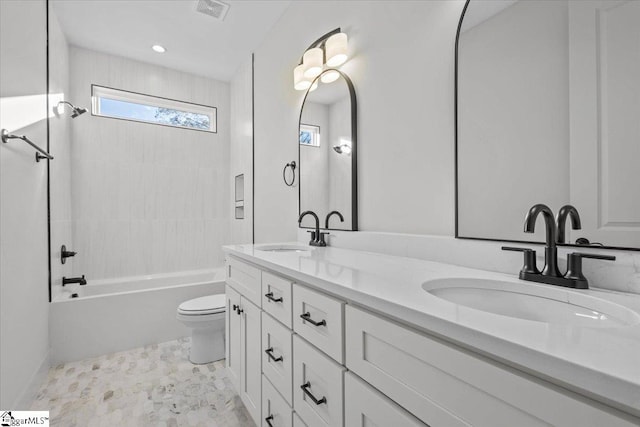 full bathroom with vanity, shower / bath combination, and toilet