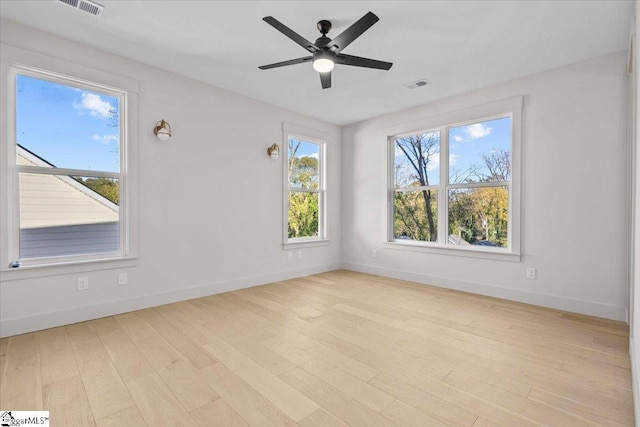 empty room featuring ceiling fan and light wood-type flooring