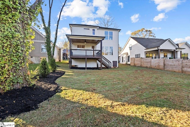 back of house featuring a lawn